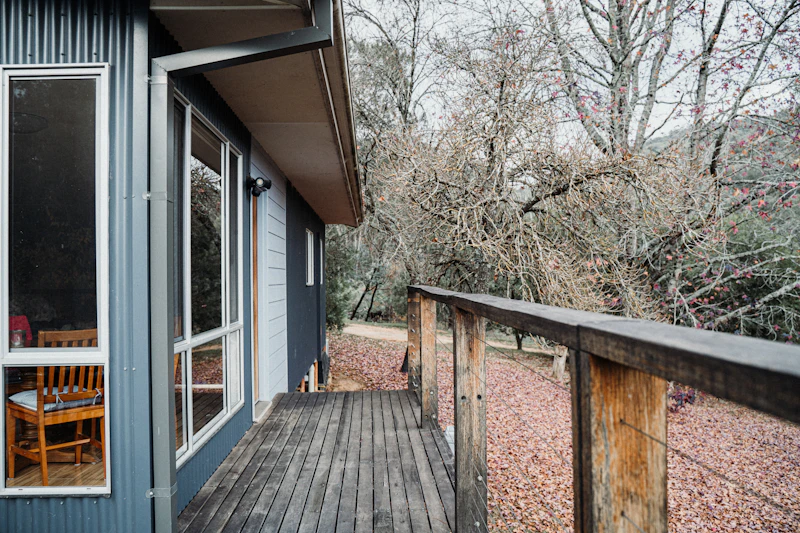 Refinished wooden deck with outdoor furniture